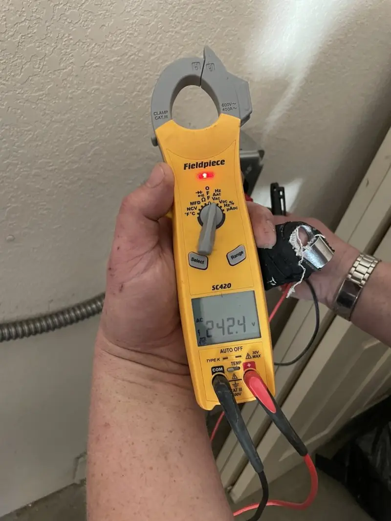Voltage testing with clamp meter during Recessed Lighting Installation in Caruthersville